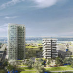 Inmitten der futuristischen Stadtlandschaft der Seestadt Aspern erheben sich hohe, moderne Gebäude neben üppigen Grünflächen. Ein Heißluftballon schwebt über den klaren Himmel und zeichnet ein ruhiges und doch lebendiges Bild urbaner Innovation.