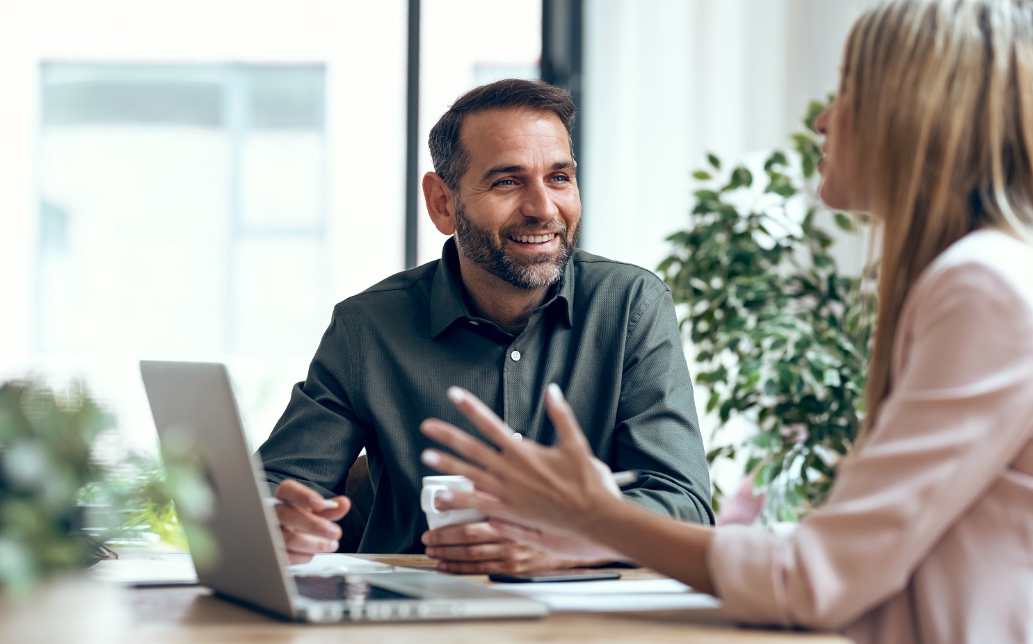 Smart business people working together with laptop while talking
